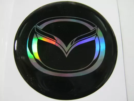 наклейка (объемная) "На колпаки "Mazda" наружная голограф., (цвет черный), (комплект 4 шт), диам.6см